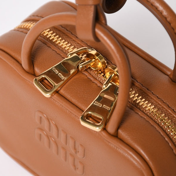 Very good condition Miu Miu Beau Leather Micro Bag Brown Mini Pouch Mini Back Charm Leather 5NR036 Gold Hardware Used 4a003388