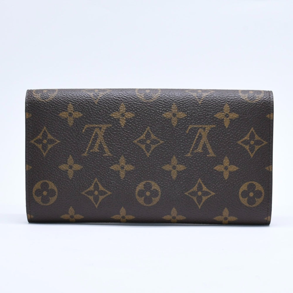 Very good condition LOUIS VUITTON Portefeuil International Trifold Wallet M61217 Monogram Gold Hardware Used 4a004691