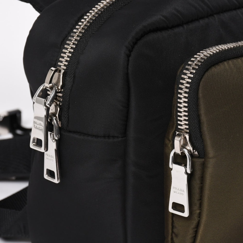 Very Good Condition PRADA TESSUTO POCKET Nylon Backpack Rucksack Body Bag 2VZ044 Black Khaki Rubber Logo Tessuto Nylon Silver Hardware Used 4a004772