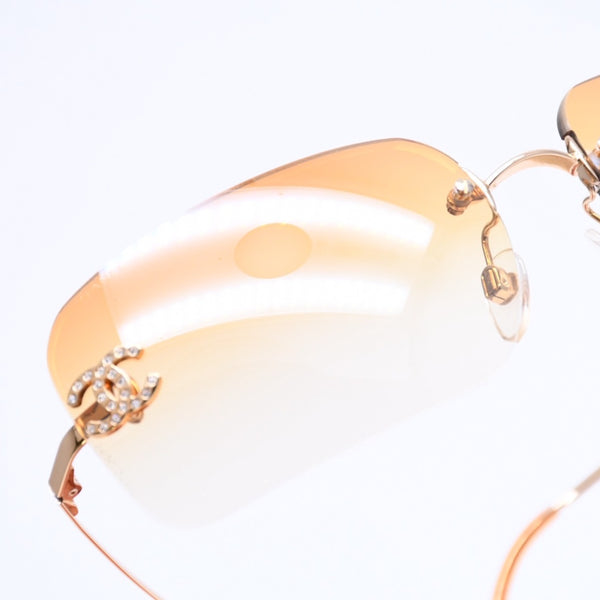 極美品 CHANEL シャネル リムレス サングラス アイウェア 4017-D c.125/56 サイズ62□17 120 ココマーク ラインストーン オレンジ 中古 4a007107