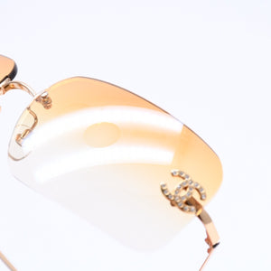 極美品 CHANEL シャネル リムレス サングラス アイウェア 4017-D c.125/56 サイズ62□17 120 ココマーク ラインストーン オレンジ 中古 4a007107