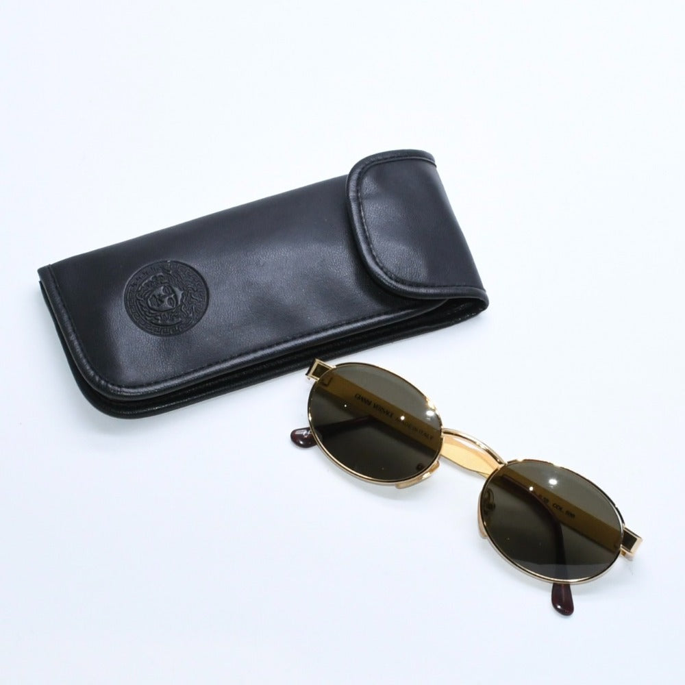 Very good condition GIANNI VERSACE Oval sunglasses Dark green lenses Made in Italy Metal Gold Used 4a008507