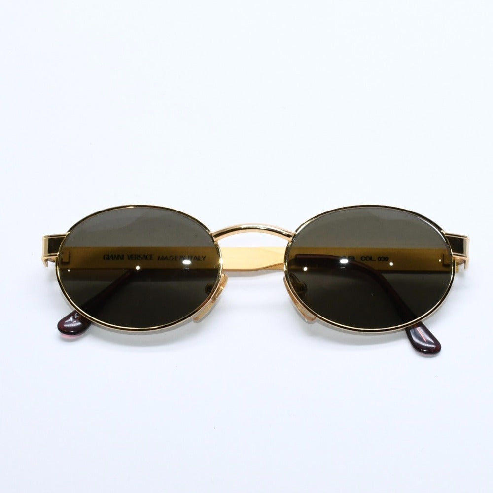Very good condition GIANNI VERSACE Oval sunglasses Dark green lenses Made in Italy Metal Gold Used 4a008507