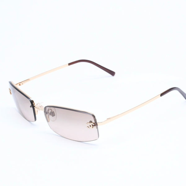 Mint condition CHANEL rimless glasses with side Coco mark, brown lenses, rhinestones, and gold hardware, 4093-B, size 56.◻16 130 Used 4a010062