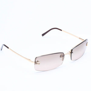 Mint condition CHANEL rimless glasses with side Coco mark, brown lenses, rhinestones, and gold hardware, 4093-B, size 56.◻16 130 Used 4a010062