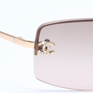 Mint condition CHANEL rimless glasses with side Coco mark, brown lenses, rhinestones, and gold hardware, 4093-B, size 56.◻16 130 Used 4a010062