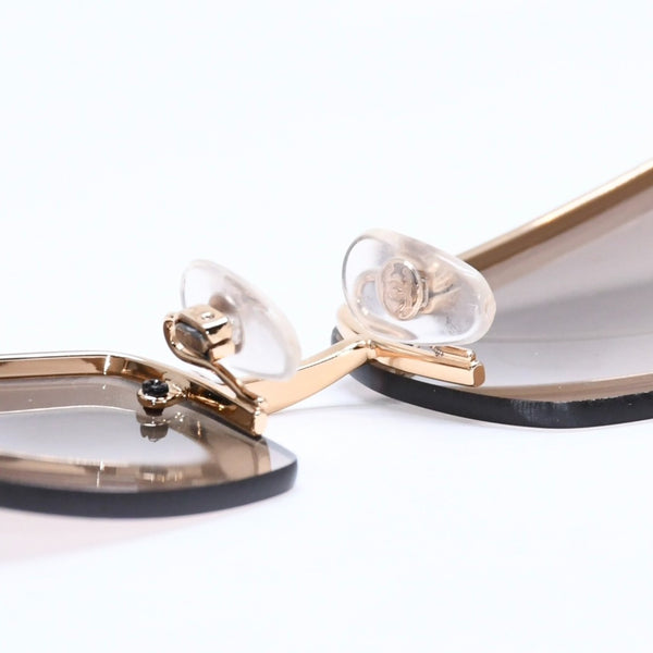 Mint condition CHANEL rimless glasses with side Coco mark, brown lenses, rhinestones, and gold hardware, 4093-B, size 56.◻16 130 Used 4a010062