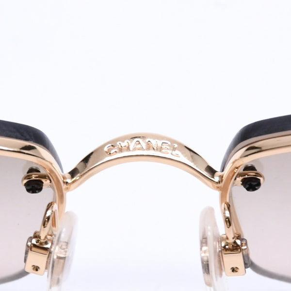 Mint condition CHANEL rimless glasses with side Coco mark, brown lenses, rhinestones, and gold hardware, 4093-B, size 56.◻16 130 Used 4a010062