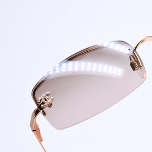 Mint condition CHANEL rimless glasses with side Coco mark, brown lenses, rhinestones, and gold hardware, 4093-B, size 56.◻16 130 Used 4a010062
