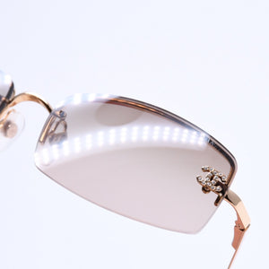 Mint condition CHANEL rimless glasses with side Coco mark, brown lenses, rhinestones, and gold hardware, 4093-B, size 56.◻16 130 Used 4a010062