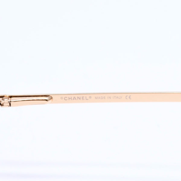 Mint condition CHANEL rimless glasses with side Coco mark, brown lenses, rhinestones, and gold hardware, 4093-B, size 56.◻16 130 Used 4a010062