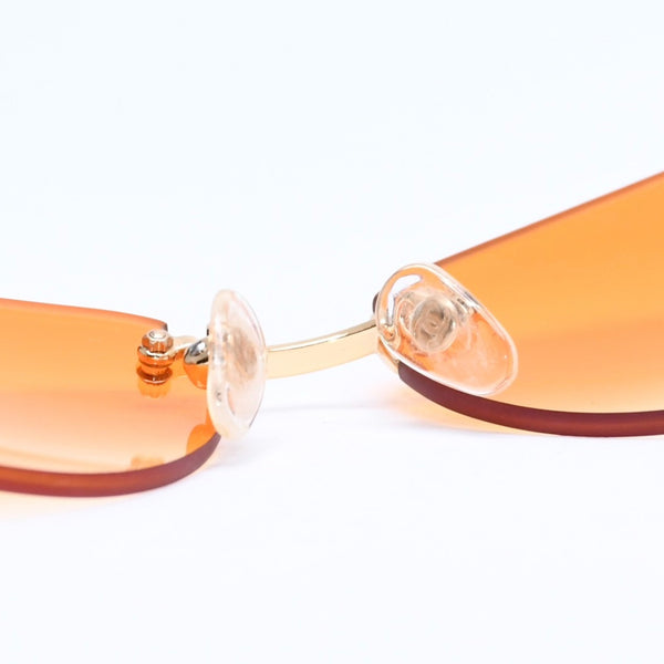 CHANEL rimless sunglasses with side Coco mark, orange lenses, and gold hardware, model number 4013 c.125/56, size 59.◻16 130 Excellent condition Used 4a010063