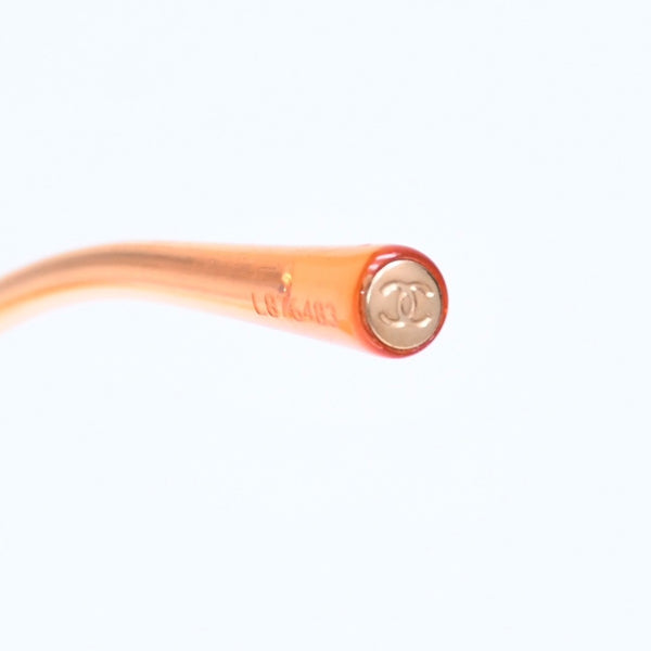 CHANEL rimless sunglasses with side Coco mark, orange lenses, and gold hardware, model number 4013 c.125/56, size 59.◻16 130 Excellent condition Used 4a010063