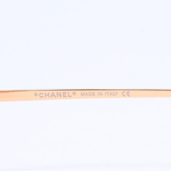 CHANEL rimless sunglasses with side Coco mark, orange lenses, and gold hardware, model number 4013 c.125/56, size 59.◻16 130 Excellent condition Used 4a010063