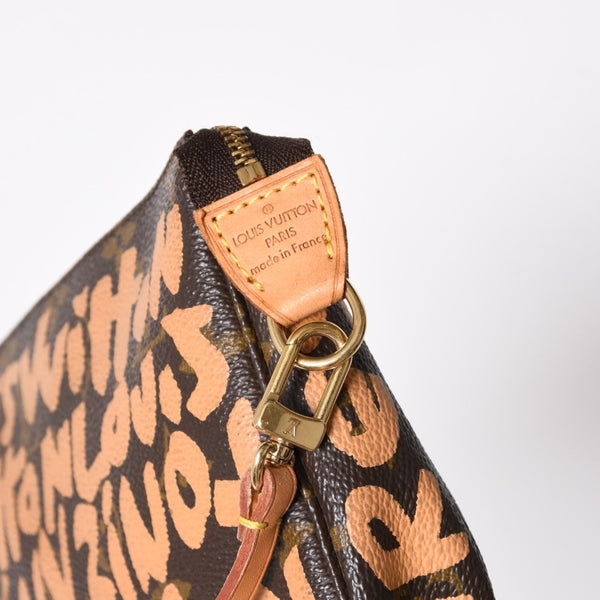 Very good condition LOUIS VUITTON Pochette accessory M92192 Monogram graffiti brown orange gold hardware used 4a009783