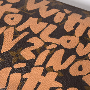 Very good condition LOUIS VUITTON Pochette accessory M92192 Monogram graffiti brown orange gold hardware used 4a009783