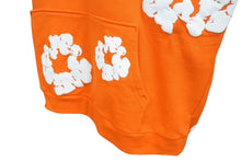 Load image into Gallery viewer, 新品未使用 DENIM TEARS デニムティアーズ THE COTTON WREATH コットンリース フーディー 0F28883E サイズXL オレンジ 中古 4b004848