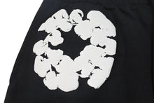 Load image into Gallery viewer, 新品未使用 DENIM TEARS デニムティアーズ THE COTTON WREATH コットンリース スウェットパンツ DT29834 サイズXXL ブラック 中古 4b004850