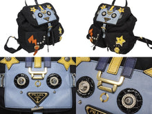 画像をギャラリービューアに読み込む, PRADA プラダ リュック テスート ロボット パッチ トライアングルロゴ 1BZ811 ナイロン レザー ブラック マルチカラー 美品 中古 4b005584