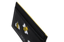 Load image into Gallery viewer, 新品未使用 CHRISTIAN DIOR クリスチャンディオール KAWS カウズ コラボ カードケース 10-BO-0179 ブラック イエロー 中古 4b008707