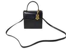 Load image into Gallery viewer, YVES SAINT LAURENT イヴ サンローラン ハンドバッグ 台形型 YSL ロゴ チャーム付き レザー ゴールド金具 ブラック 美品 中古 67291