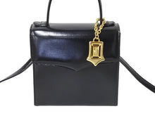 Load image into Gallery viewer, YVES SAINT LAURENT イヴ サンローラン ハンドバッグ 台形型 YSL ロゴ チャーム付き レザー ゴールド金具 ブラック 美品 中古 67291