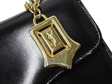 Load image into Gallery viewer, YVES SAINT LAURENT イヴ サンローラン ハンドバッグ 台形型 YSL ロゴ チャーム付き レザー ゴールド金具 ブラック 美品 中古 67291