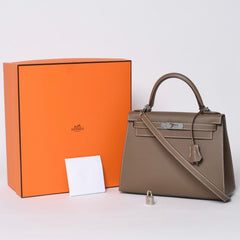 新品未使用 HERMES エルメス ケリー28 外縫い エトゥープ B刻印 ヴォーエプソン シルバー金具 ハンドバッグ 中古 4a001067